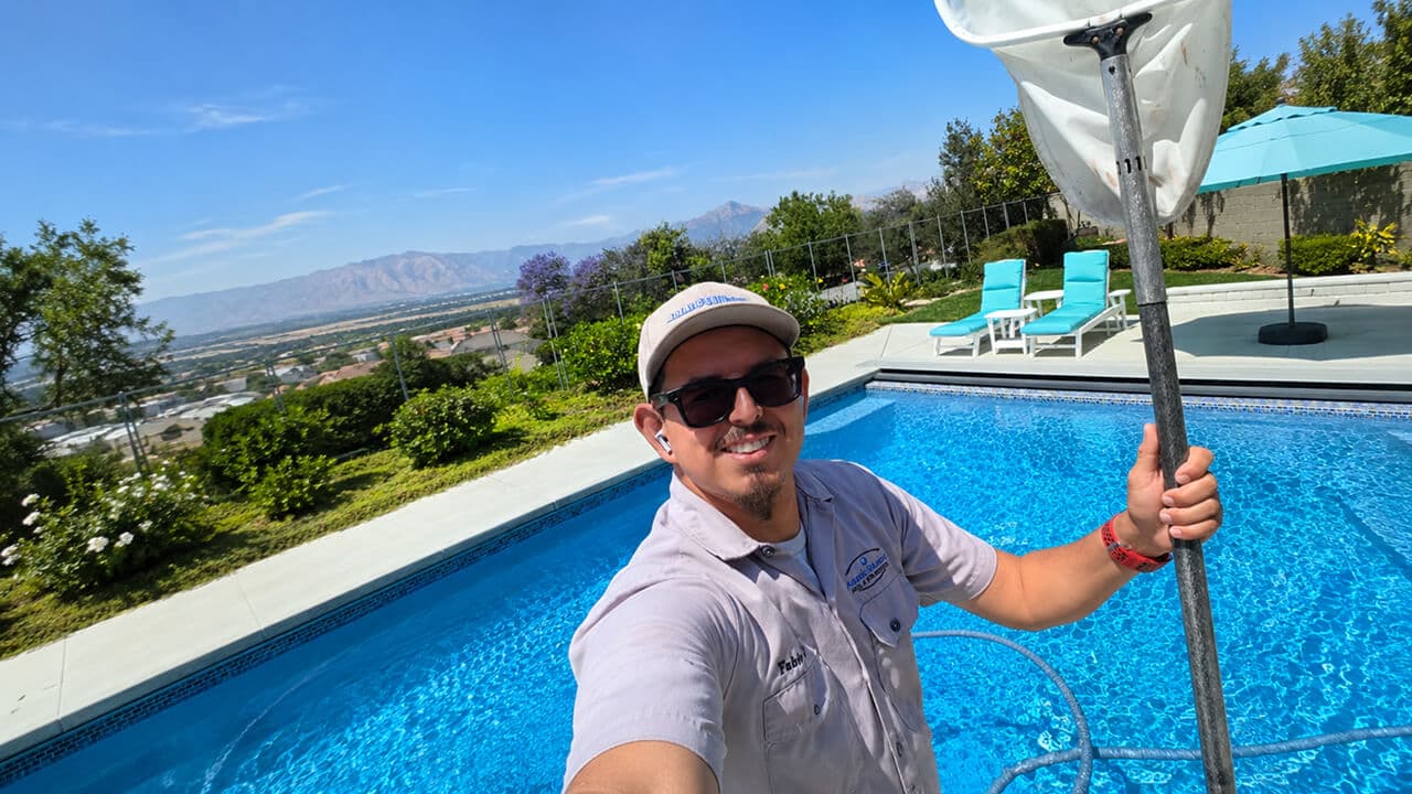 Fabio servicing a residential pool for Aquatic Solutions